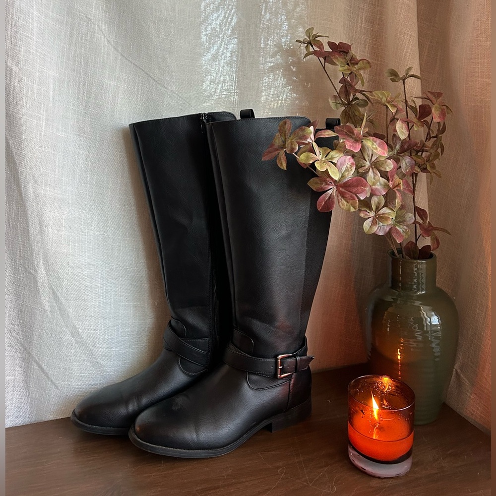 Tall black leather riding boots